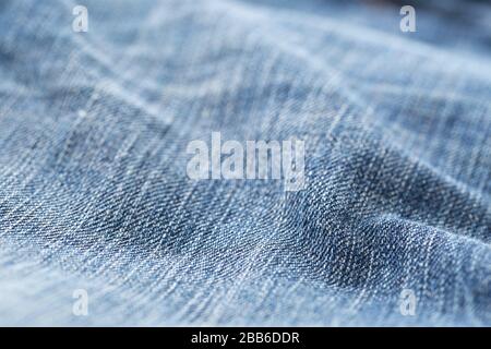 Blue jeans denim fabric close up - jeans fashion concept background, selective focus Stock Photo