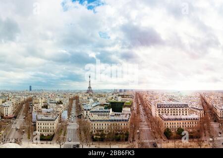 Panoramic urban skyline of Haussmanian buildings and Eiffel Tower in the city of Paris, France