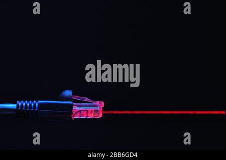 Lan Cable Is Connecting Internet and Red Laser Stock Photo