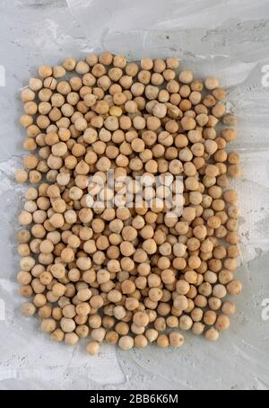 Flat lay of food background from a texture of raw chickpeas frame. Top view Stock Photo