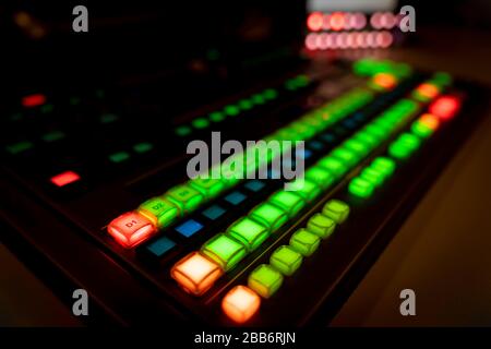 Blur image video switch of Television Broadcast, working with video and audio mixer, control broadcasts in recording studio. Broadcasting in the studi Stock Photo