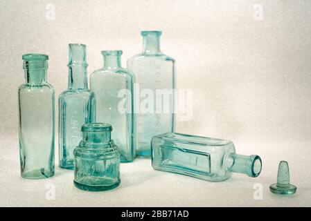 Vintage blue glass bottles of various shapes and sizes - still life Stock Photo