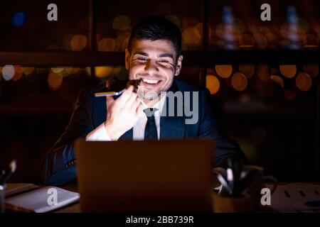 Office Manager Guy Using Voice Assistant On Smartphone In Office Stock Photo