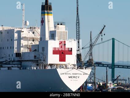 2020:March 27 SAN PEDRO, CALIFORNIA USA: U.S Navy’s hospital ship USNS Mercy arriving at the Port of Los Angeles, navy nurse now has the Coronavirus Stock Photo