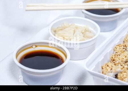 soy sauce in a disposable bowl on a white background Stock Photo