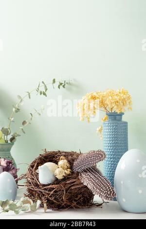 Easter ornaments in light and pastel colors with clear light, with eggs and rabbits, ornaments for the home, interior, bird nest with eggs inside Stock Photo