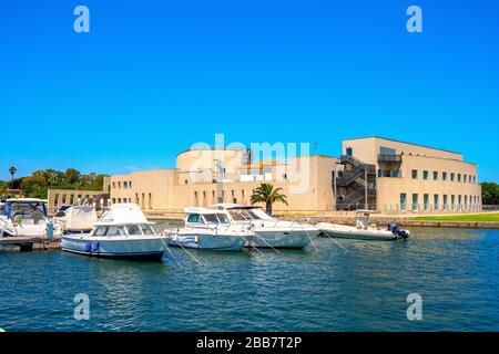 Olbia, Sardinia / Italy - 2019/07/21: Panoramic view of the Archeological Museum of Olbia - Museo Archeologico - on Gulf of Olbia island at the port Stock Photo