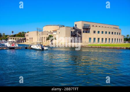 Olbia, Sardinia / Italy - 2019/07/21: Panoramic view of the Archeological Museum of Olbia - Museo Archeologico - on Gulf of Olbia island at the port Stock Photo