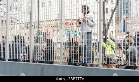 New York, NY - March 30, 2020: New Yorkers view arrival of USNS Comfort Navy ship with 1000 beds to relief NYC hospitals on COVID-19 pandemic at pier 90 Stock Photo