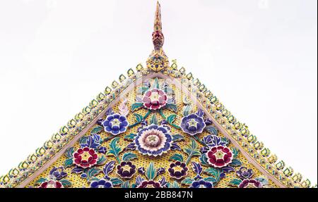 Colorful Thai Ornament Temple Decoration Pattern Roof gable Golden Thai style temple. Old floral, ceramic tile patterns of gable apex architecture in Stock Photo