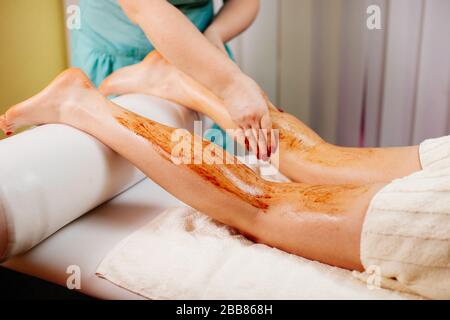 scrub body massage pampering close up Stock Photo