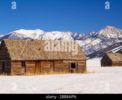 old homestead cabins below the bridger range in winter near belgrade, montana Stock Photo