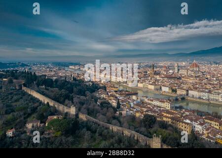 Aerial panorama of Florence at sunrise, Firenze, Tuscany, Italy, cathedral, river, drone pint view, mountains is on background Stock Photo