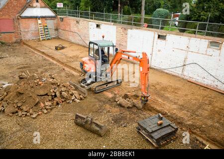 BUCKINGHAM, UK - September 19, 2016. Digger machine working on a domestic building site in Buckinghamshire, UK Stock Photo