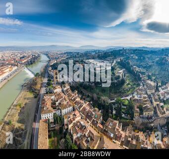 Aerial panorama of Florence at sunrise, Firenze, Tuscany, Italy, cathedral, river, drone pint view, mountains is on background Stock Photo