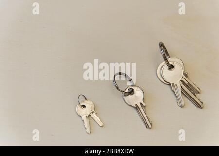 Three iron keys on the wood background. Copy space. Flat lay. Stock Photo