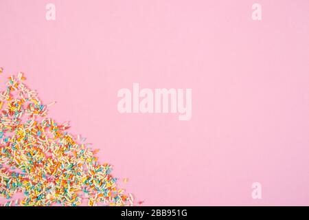 Mix of colorful sugar sticks on pink background Stock Photo