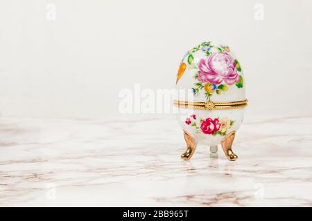 Luxury Easter egg with decorations on a marble background Stock Photo