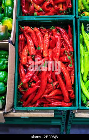 Plastic boxes with hot red hot chilli peppers in markets Stock Photo