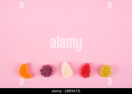 colorful candies jelly on pink background Stock Photo