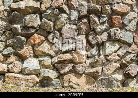 Closeup surface nature stone pattern at old brown stone brick wall textured at the fence background Stock Photo