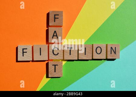 Fact and Fiction, words in wood alphabet letters on colorful background Stock Photo