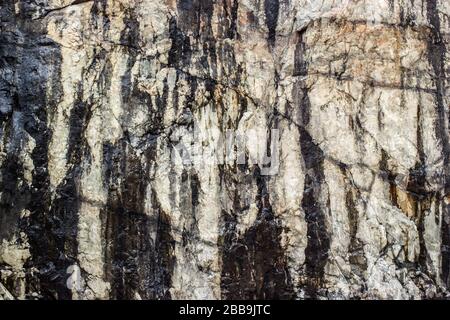 Natural dirty rustic rock stone,The texture of stone wall corrosion or grunge stone texture background Stock Photo