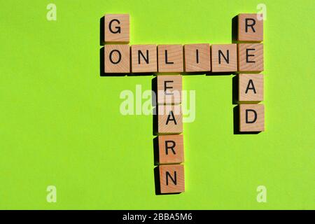 Go Online, Read, Learn, crossword on green background Stock Photo