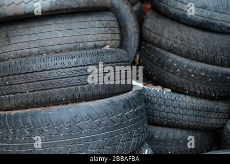 Old tires are on the street. Close up. Stock Photo