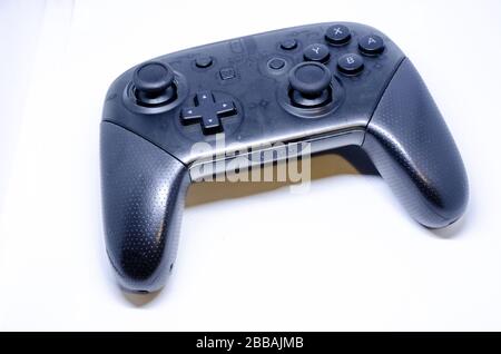A gaming controller for a Nintendo Switch games console isolated on a white background. Stock Photo