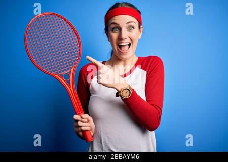 Smiling Cute Female Tennis Player with a Racket in Hands Stock