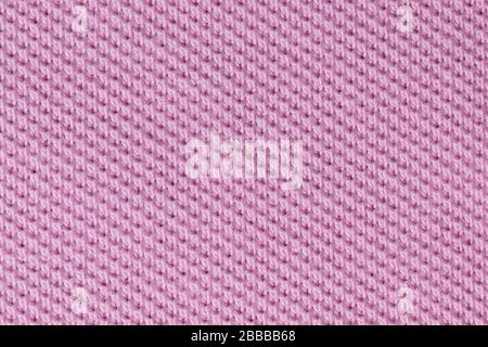 Light pink cotton fabric polo shirt texture background. Background textile surface with copy space for text. Stock Photo