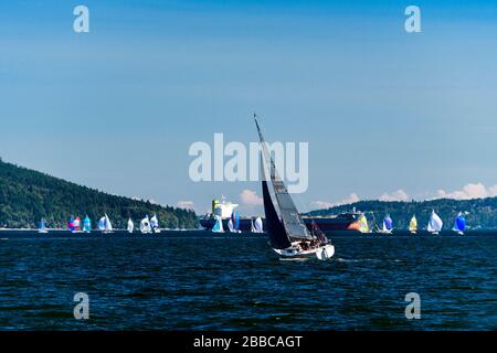 Sailboats racing during the Cowichan Bay Sailing Regatta in Cowichan Bay, British Columbia. Stock Photo