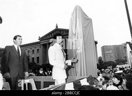 Mayor Bill Green presenting a 'Rocky' statue with fans and friends to Sylvester Stallone at the premiere of Rocky III in Philadelphia, PA in 1982. Credit: Scott Weiner / MediaPunch Stock Photo