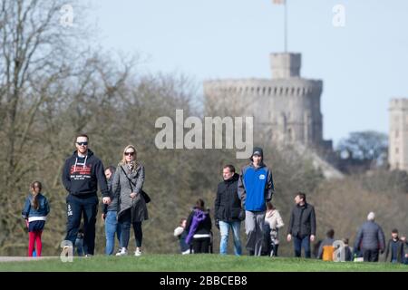 People walking on the Long Walk in Windsor Great Park, UK. The covid19 outbreak and social distancing measures were recently announced 21.03.2020