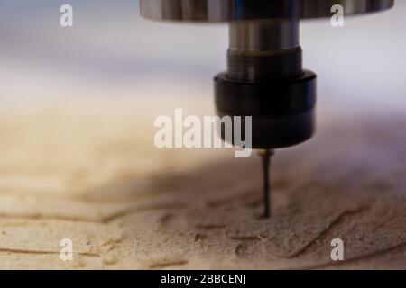 wood milling on modern automatic woodworking machine with CNC. furniture production. Stock Photo