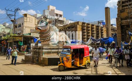 Madurai, India - March 2020: People walking around the blue Nandi in front of the entrance of the Pudhu Mandapa on March 10, 2020 in Madurai, India. Stock Photo