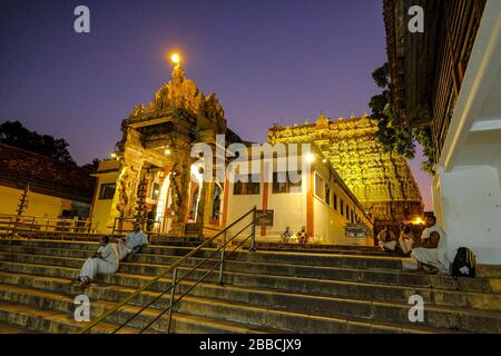 Thiruvananthapuram, India - March 2020: People sitting on the steps of the Shri Padmanbhaswamy temple on March 13, 2020 in Thiruvananthapuram, India. Stock Photo