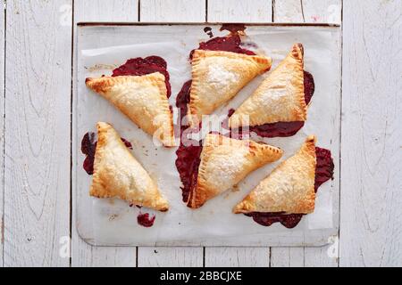 pastry, cherry, puff, fruit, turnover, dessert, sweet, crust, pie, gourmet, food, fresh, bakery, sugar, delicious, golden, snack, tasty, homemade, jam Stock Photo