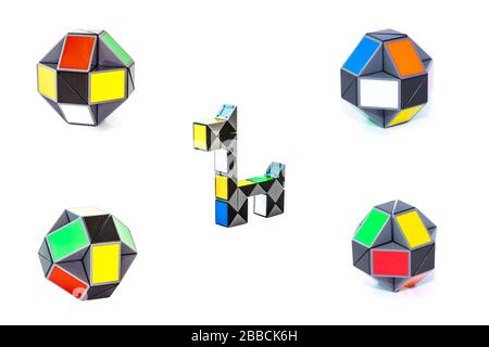 Set of toy colorful snake puzzles in shape of balls and dog on white background. Full size. Stock Photo