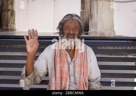 UDAIPUR, INDIA - 21ST MARCH 2016: A typical Indian man in Udaipur waving towards the camera. Stock Photo