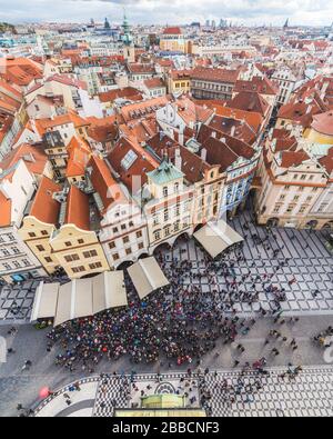 PRAGUE, CZECH REPUBLIC - 21ST OCT 2016: Views of Prague skyline from the Old Town Hall tower showing the outside of buildings, rooftops and people. Stock Photo