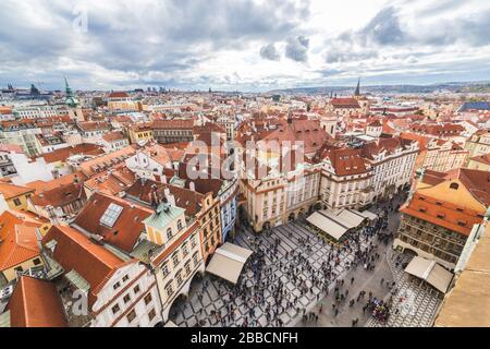 PRAGUE, CZECH REPUBLIC - 21ST OCT 2016: Views of Prague skyline from the Old Town Hall tower showing the outside of buildings, rooftops and people. Stock Photo