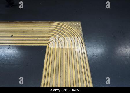 Tactile paving in a an underground metro station in Naples, Italy. Stock Photo