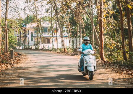 Goa, India - February 14, 2020: Man Riding On Scooters Motorcycle On Street. Stock Photo
