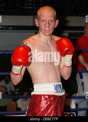 Ryan Barrett (red shorts) defeats Sid Razak in a Lightweight boxing ...