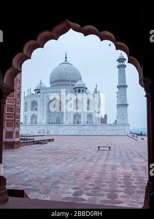 Taj Mahal though an arched gate Stock Photo