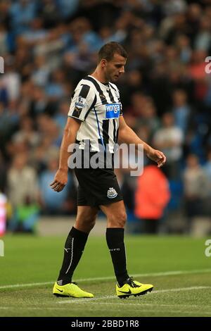 Newcastle United's Steven Taylor leaves the pitch after being sent-off by match referee Andre Marriner (not in picture) after fouling Manchester City's Sergio Aguero (not in picture) Stock Photo