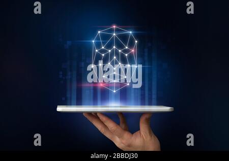 Unrecognizable man holding tablet computer with polygonal face hologram on dark background, collage Stock Photo