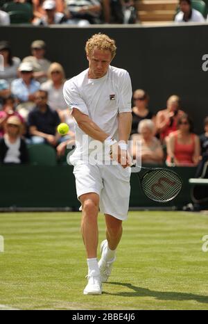 Russia's Dmitry Tursunov in action against Germany's Tommy Haas during day two of the Wimbledon Championships at The All England Lawn Tennis and Croquet Club, Wimbledon. Stock Photo